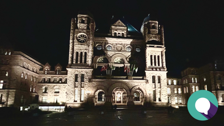 Night time exterior photo of Queen's Park, home of the Ontario legislature