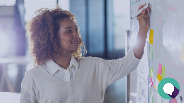 Blog header image featuring stock photo image of a woman writing on a whiteboard.