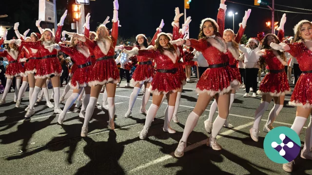 Photograph of dance troupe participating in Oshawa Santa Claus parade, overlain with blog title Discover the Magic of the Holidays with the New Oshawa Holiday Experience Website