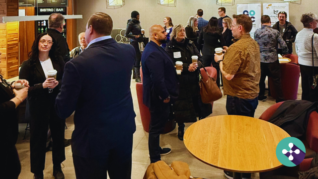 Candid photo from a recent Oshawa Chamber of Commerce networking event in Oshawa overlain with blog article title What’s Brewing? A warm welcome to networking in Oshawa